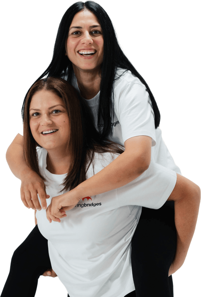 Two friendly Caring Bridges support workers