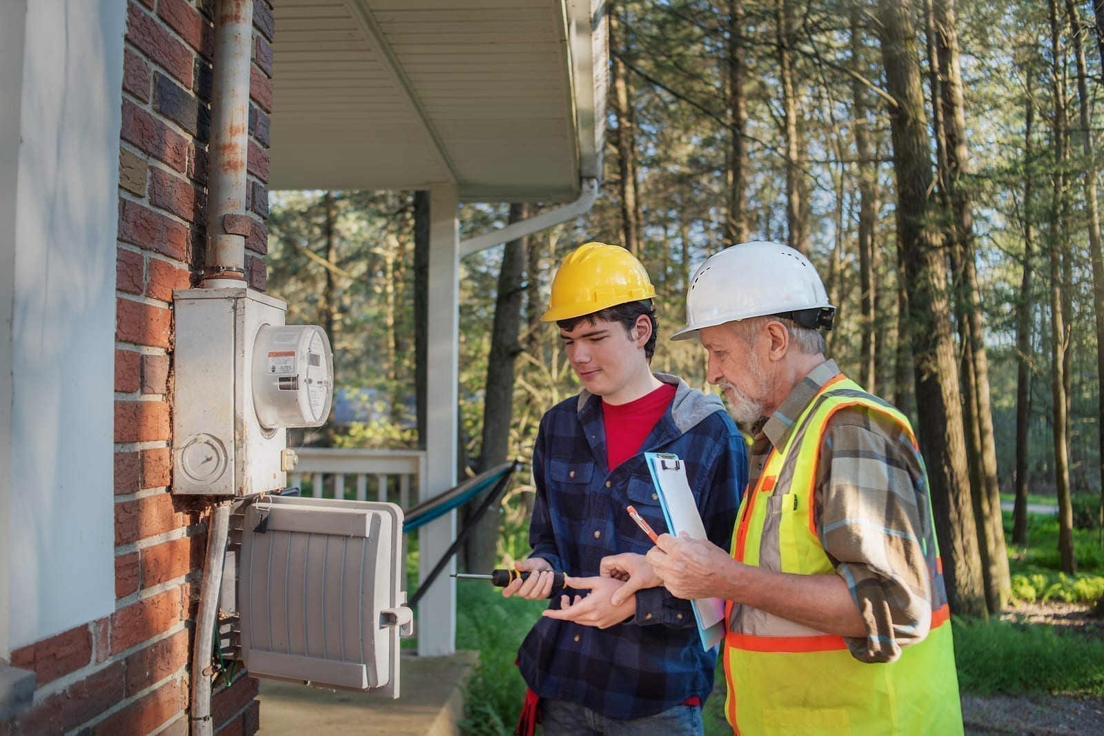 A mentor guiding an apprentice through hands-on training