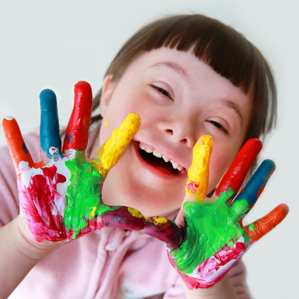 disabled child with coloured fingers