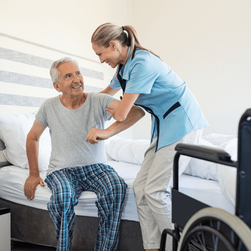 Carer helping the participant to get out of bed