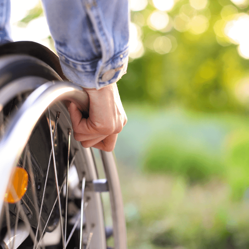 disabled patient on a wheelchair in green background